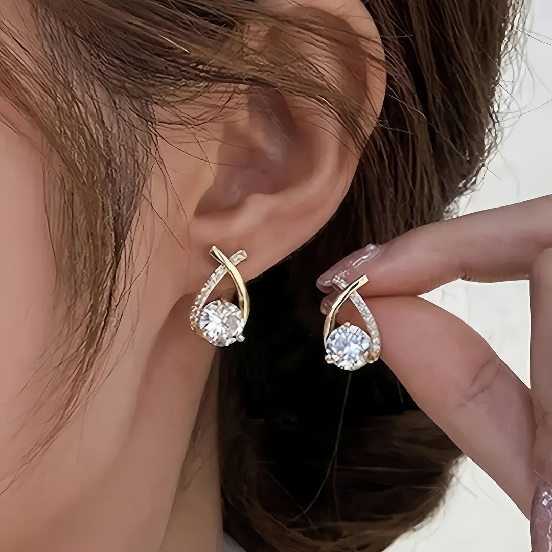 Earrings with gold cross and zirconia